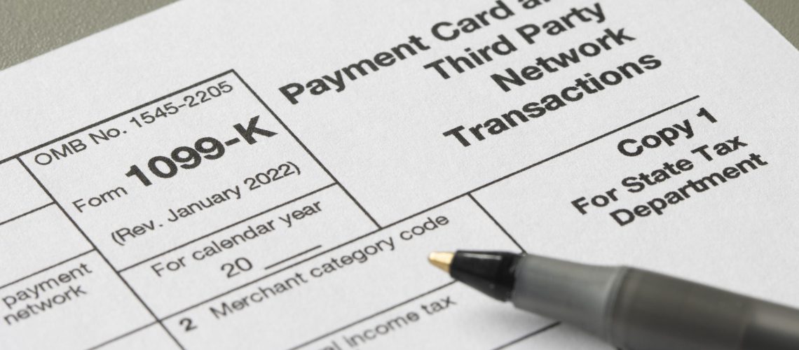 Closeup of Form 1099-K, Payment Card and Third Party Network Transactions, an IRS information return used to report certain payment transactions to improve voluntary tax compliance.